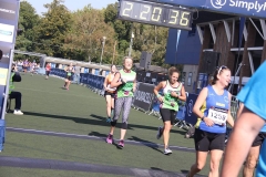 Adele crossing the finish line